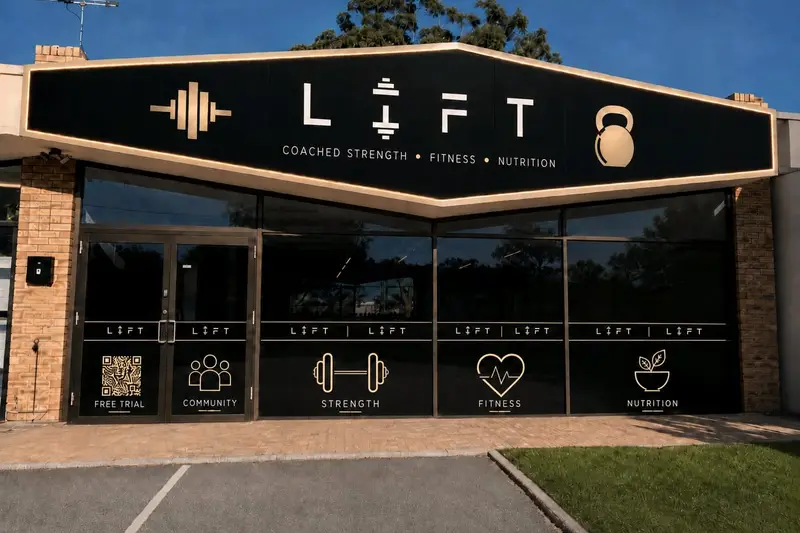 The LIFT shopfront: a black and gold sign reading LIFT, Coached strength, Fitness, Nutrition, above dark windows with gold LIFT graphics.