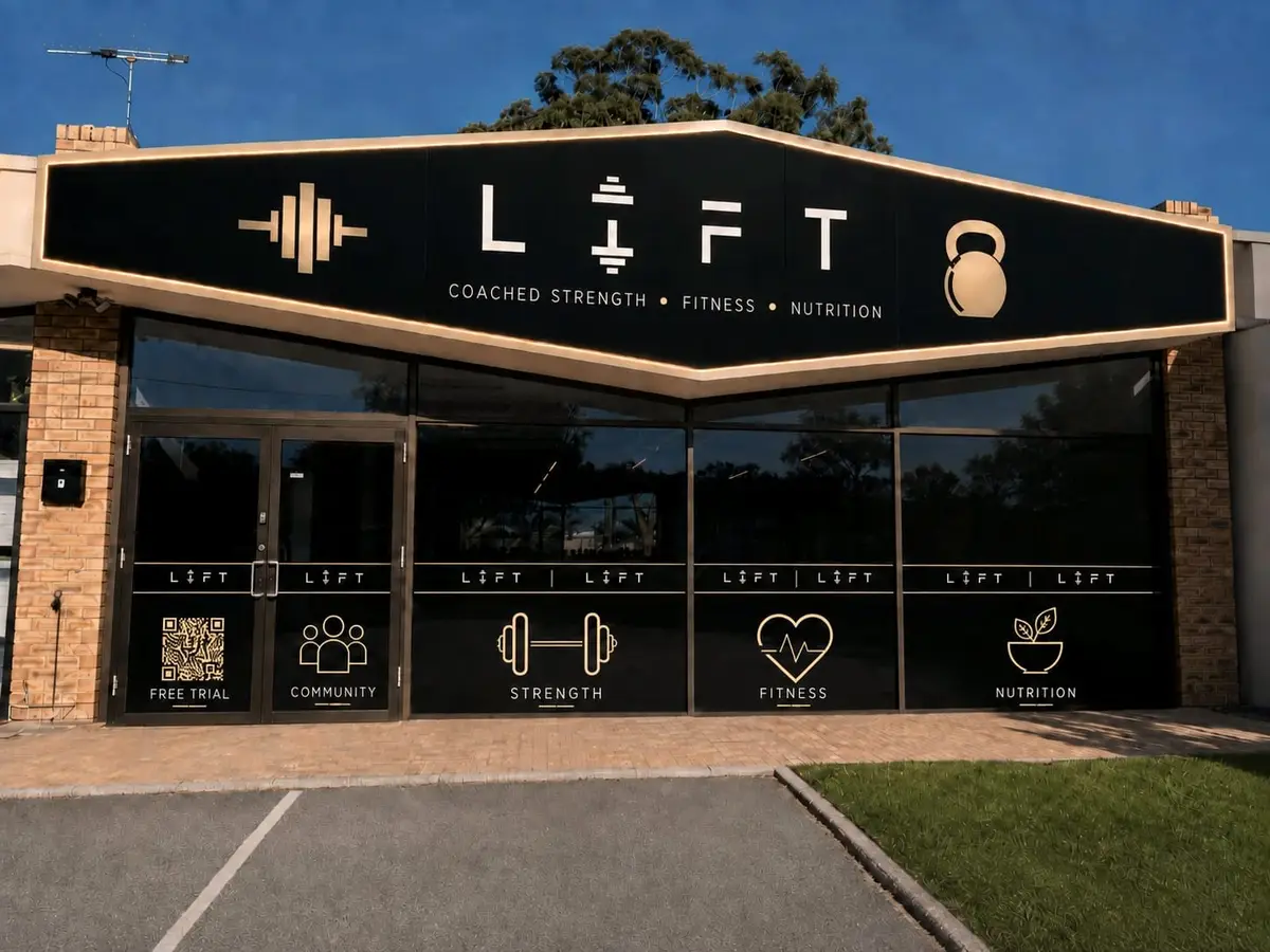 The LIFT shopfront: a black and gold sign reading LIFT, Coached strength, Fitness, Nutrition, above dark windows with gold LIFT graphics.